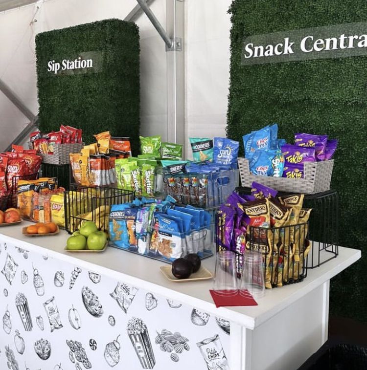 Team members reviewing snack options at a shared workplace pantry